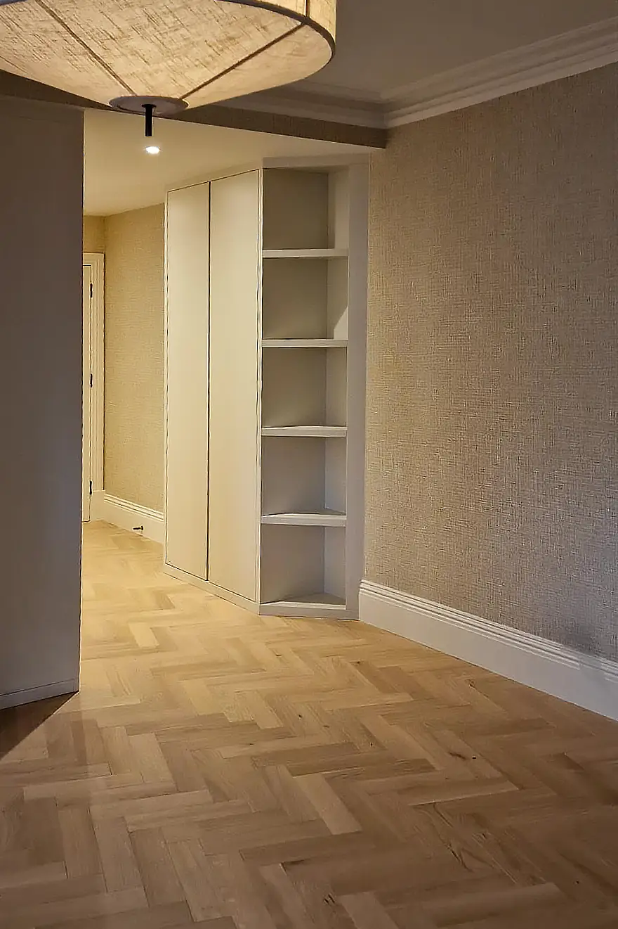 Custom fitted storage units built into hallway space in Chelsea